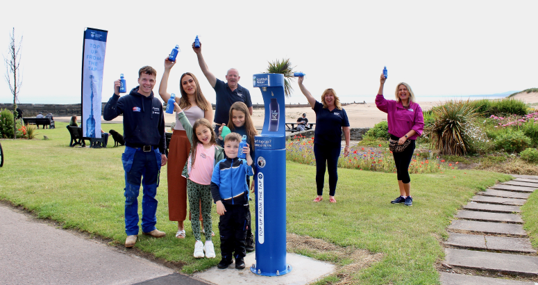 Rico Thompson and his family launch the new top up tap in Lossiemouth, with the help of Scottish Water's Ewan Shand and Elaine MacArthur and Lossiemouth Community Council's Carolle Ralph