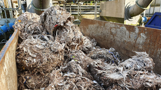 mounds of wet wipes in a skip