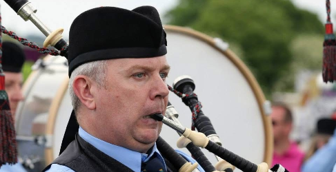 John at the World Pipe Band Championships 40 Years Service