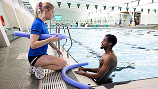 Learn to Swim Never Too Late Learn to Swim teacher Lucy McCluskey gives Amanuel Akalu a lesson in the pool