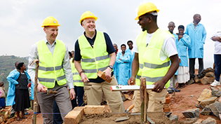 Ewan Robertson helps build new school latrines in Rwanda