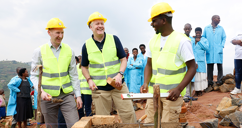 Ewan Robertson helps build new school latrines in Rwanda