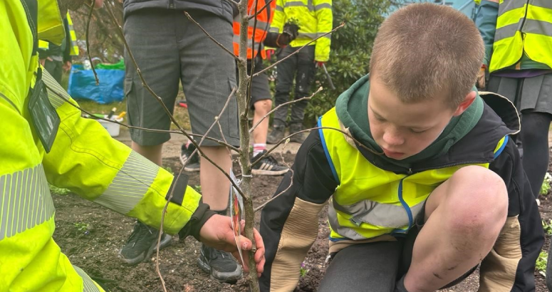 The pupils got their hands dirty planting trees and bedding flowers at the site