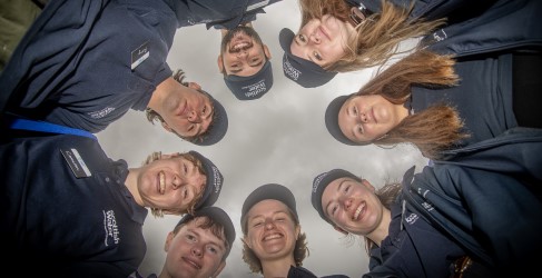 Scottish Water Employees Smiling in a Circle of Faces