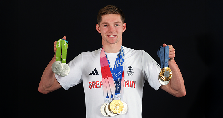 Olympic swimming champion Duncan Scott OBE with his medals