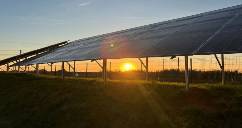 Sun setting below the new solar panels at Gailes waste water pumping station