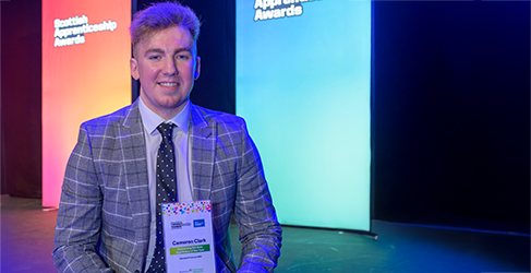 Scottish Water apprentice Cameron Clark with his award for Net Zero Apprenticeship of the Year at the Scottish Apprenticeship Awards