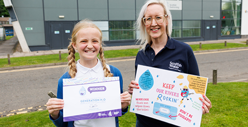 Scottish Water employee Lorna Neilson with poster designed by winner Anna Lynas