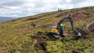 Diggers at work restoring peatland at Backwater Reservoir