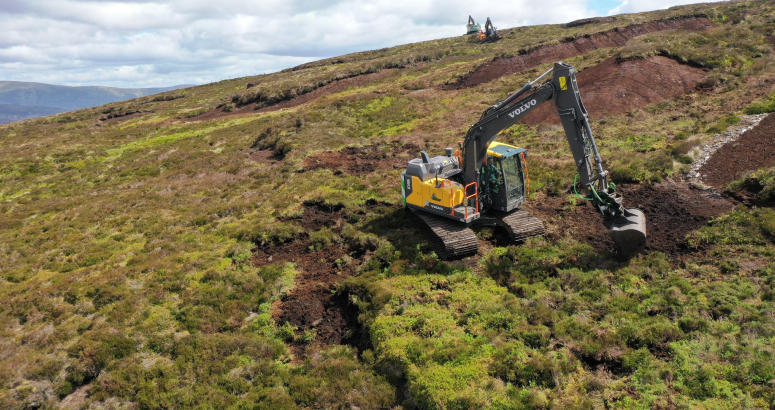 Diggers at work restoring peatland at Backwater Reservoir